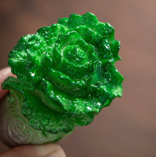 A close up shot of a jade-like cabbage teapet