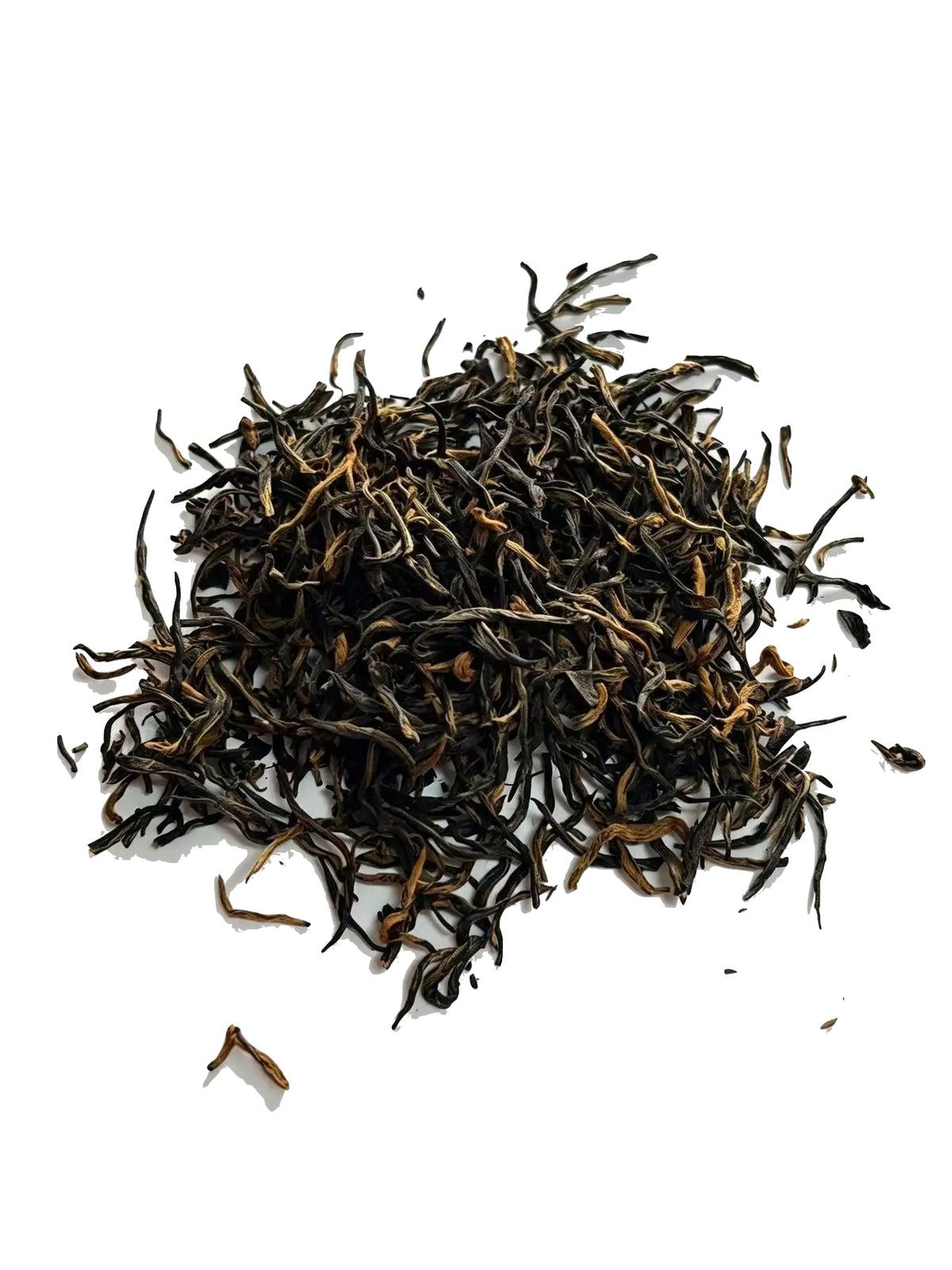 A small pile of loose-leaf Jin Jun Mei tea leaves, primarily dark brown with lighter golden-brown tips, scattered on a plain white background.